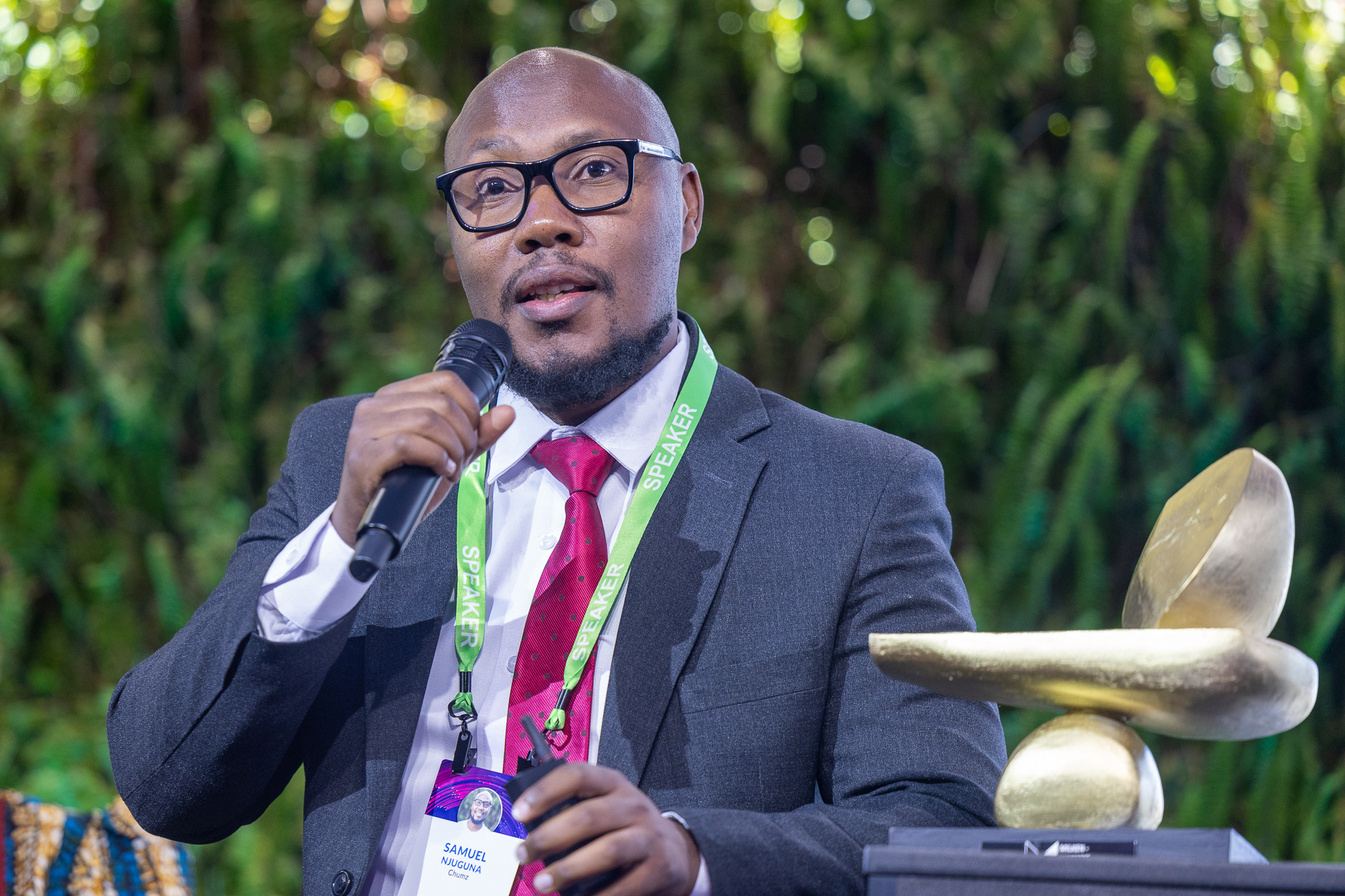 Samuel Njuguna, founder of Chumz, a finalist team, takes the stage to pitch at the 2025 Milken Institute Global Conference.
