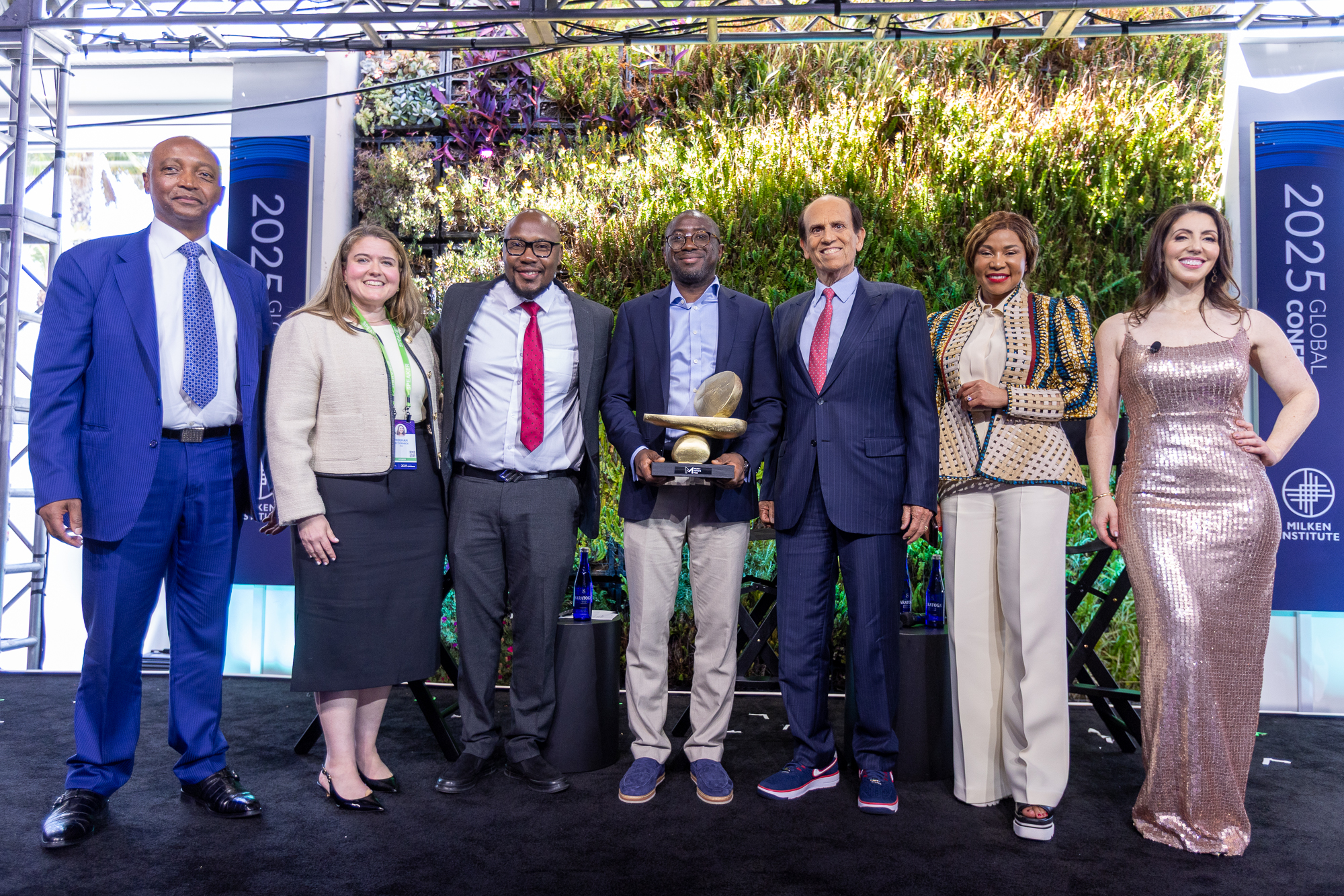 From left to right: Dr. Patrice Motsepe, Meghan McCormick, Sam Njuguna, Ola Oyetayo, Michael Milken, Dr. Precious Moloi-Motsepe, and Emily Musil, PhD.