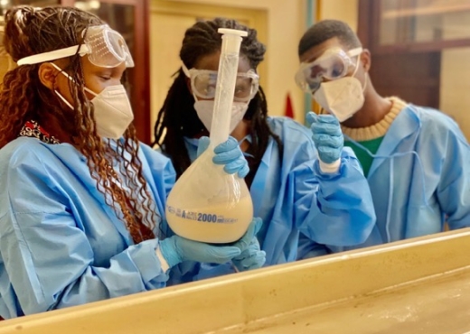 Karpolax team members testing solvents that help improve fruit shelf life at the team’s lab in Uganda