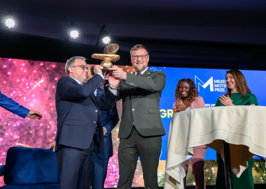 Grand prize winners, Jonathan Wilson, PhD, and Carl Telford, PhD, of Aftrak on stage at the 2024 Global Conference