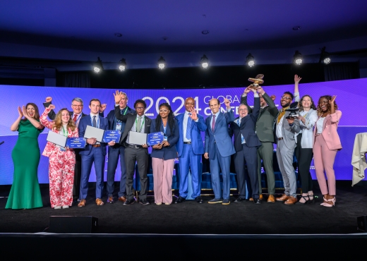 Milken-Motsepe Prize in Green Energy finalists on stage at the 2024 Global Conference with principals Dr. Patrice Motsepe and Michael Milken